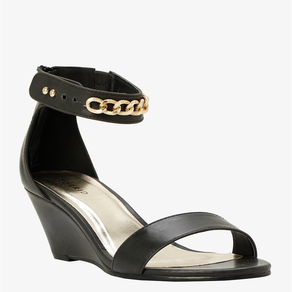 Black wedge sandals with gold accent chain